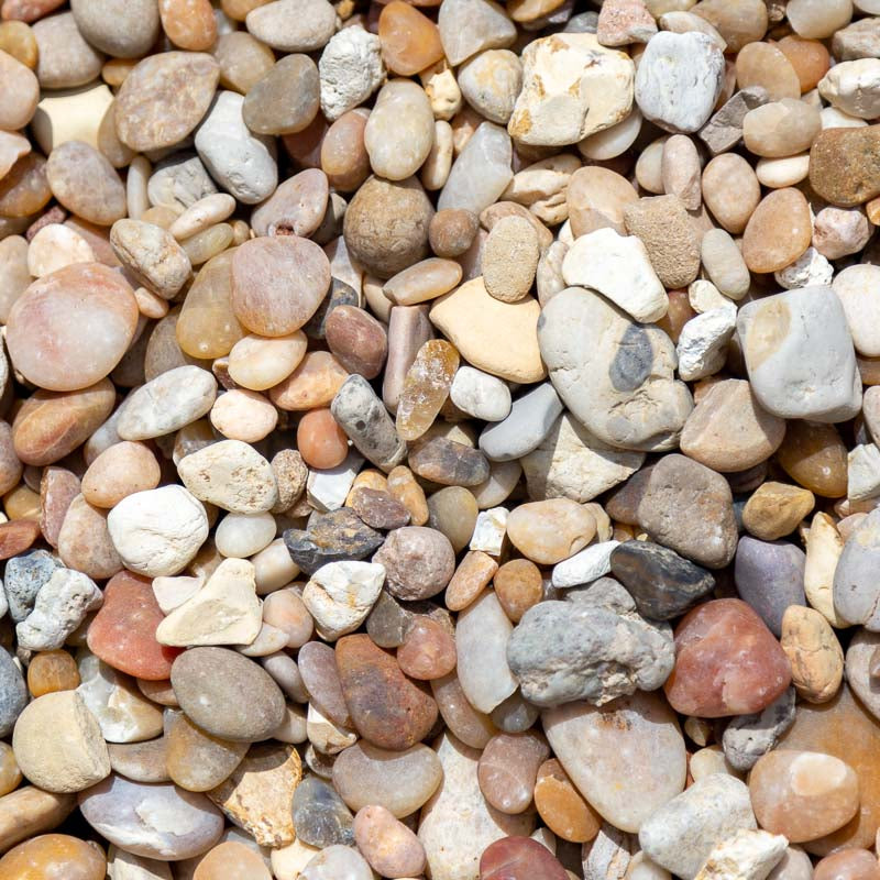 Sample 2 of Alabama sunset river rock gravel for sale with a concentration of various shades of white and cream