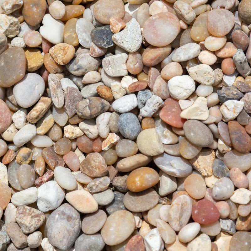 Sample 3 of Alabama sunset river rock gravel for sale with a concentration of various shades of white and cream