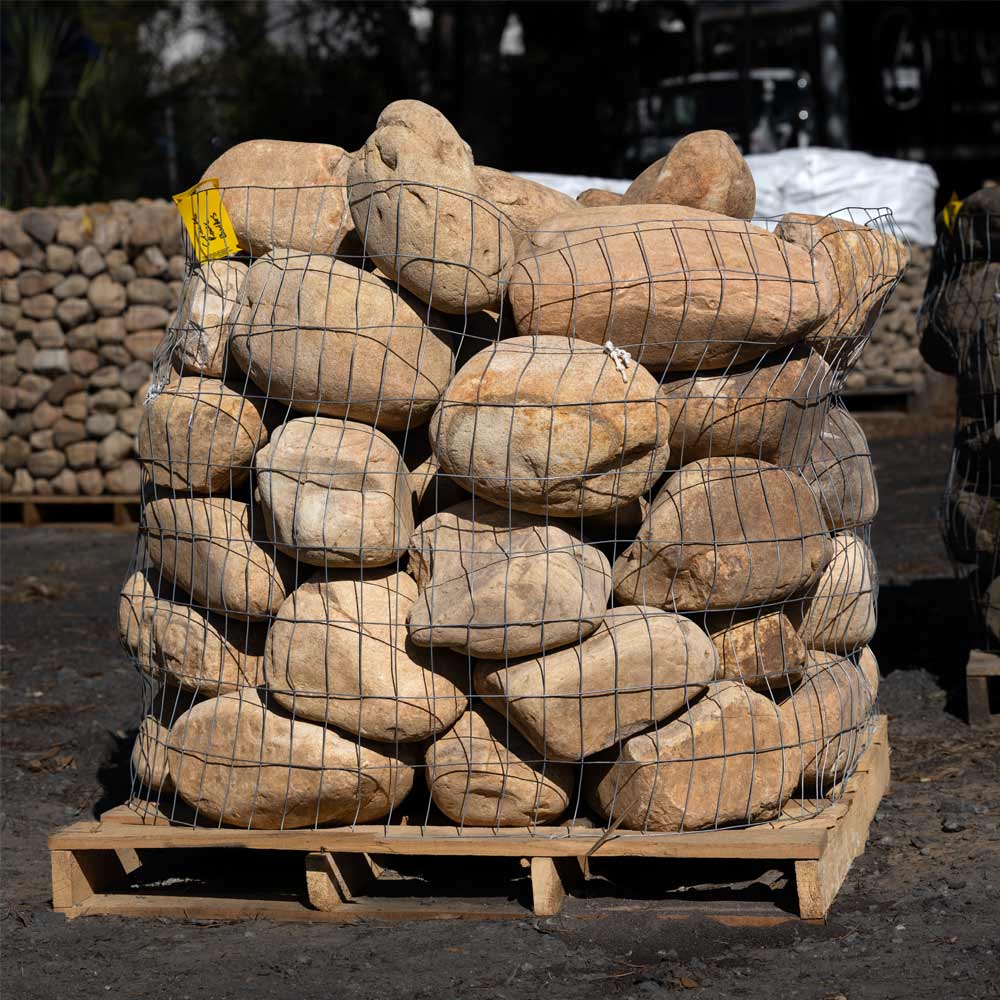 Stack of large stones or boulders on a wooden pallet for sale in jacksonville fl 