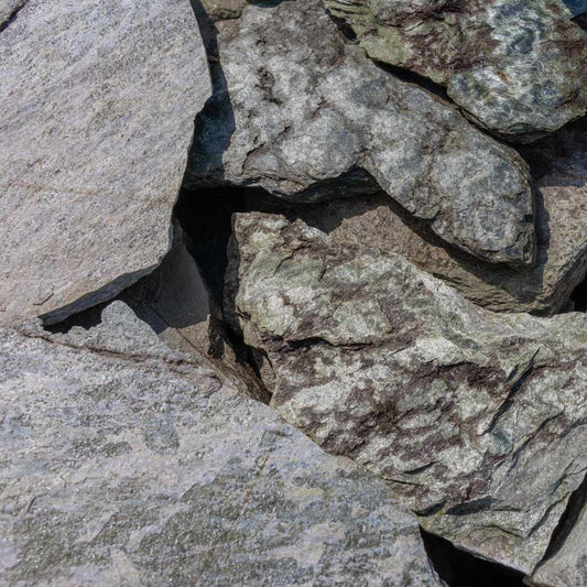 Close-up of a stone wall with gray and brown stones