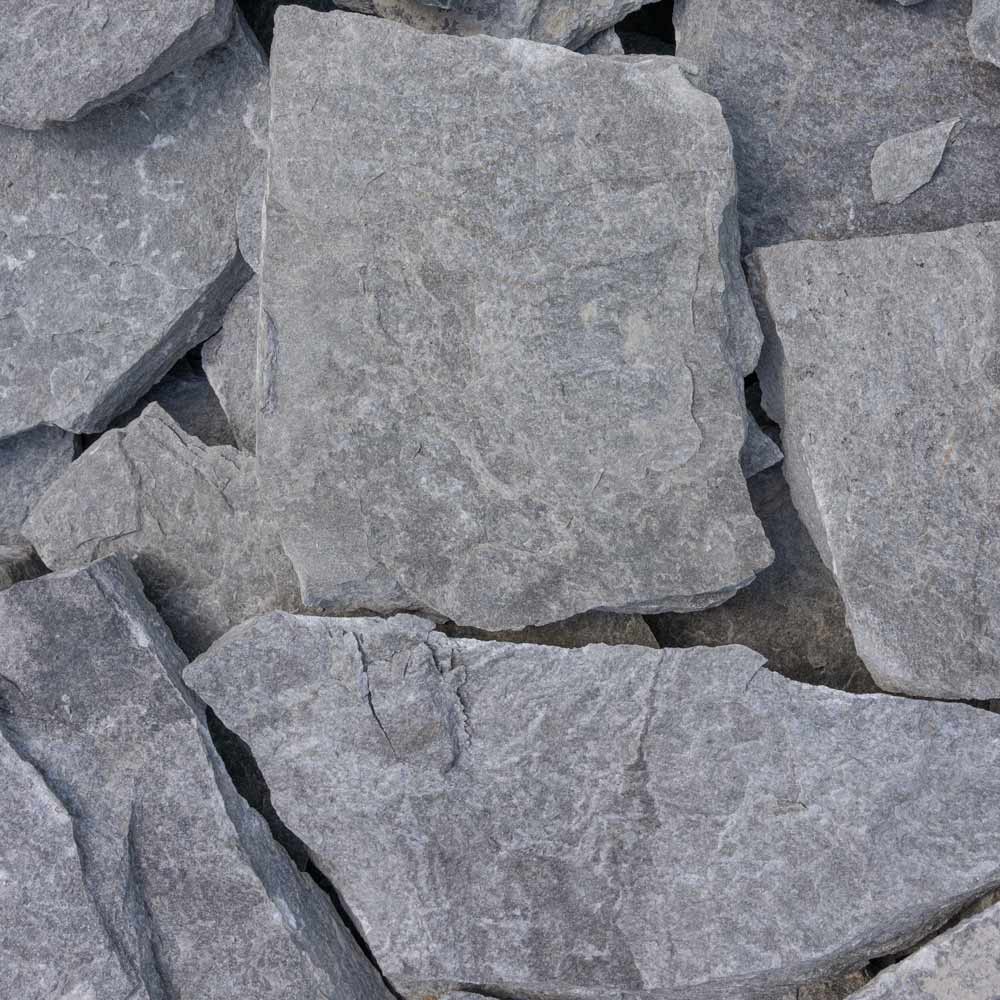 Close-up of gray stone tiles with a rough texture.