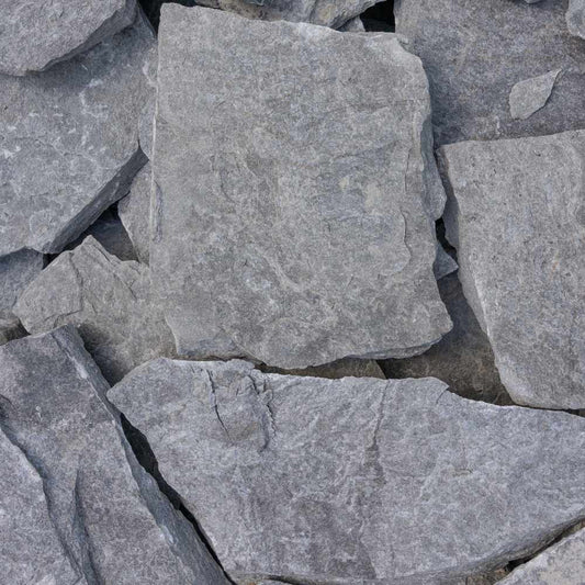 Close-up of gray stone tiles with a rough texture.